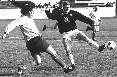 David Meechan charges down a defensive clearance